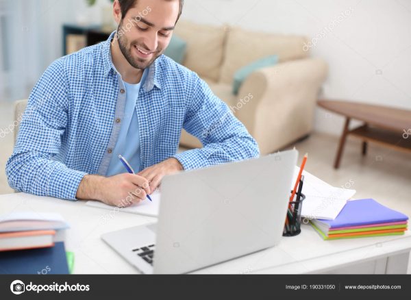 student at laptop working on exam