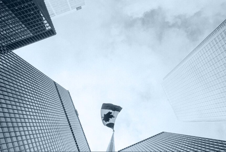 Canadian flag atop a skyscraper